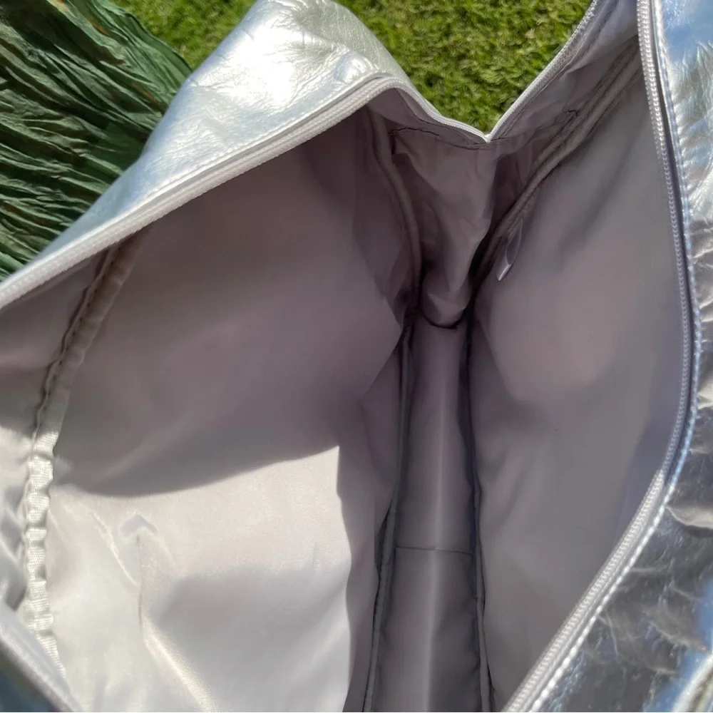 NWOT metallic silver laptop bag. Silver.    .